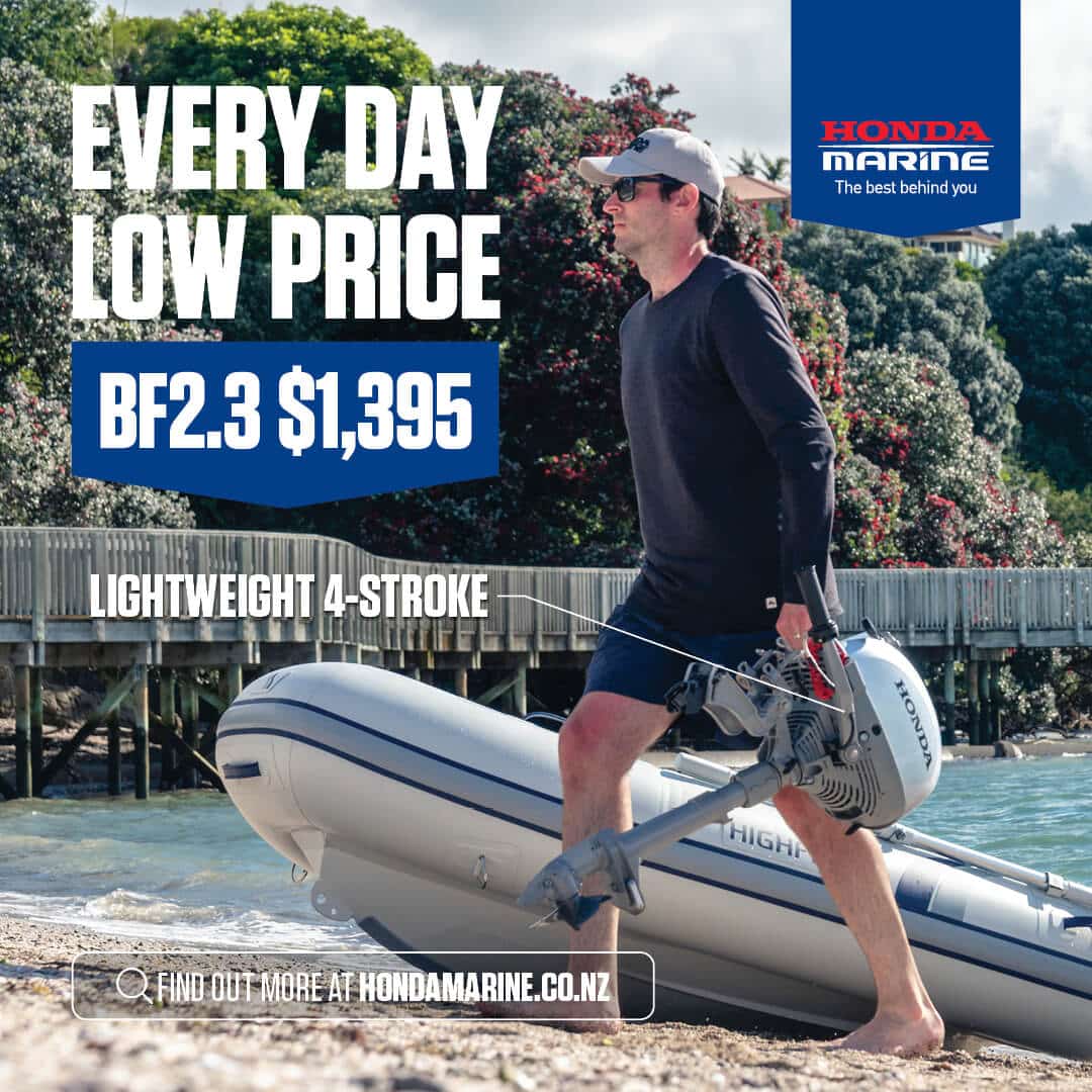 Man with sunglasses walks a rigid inflatable boat onto a beach, an ad banner reads BF2.3  alt=